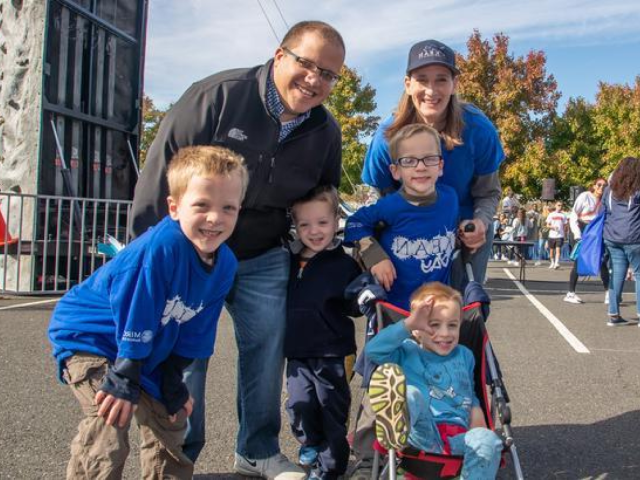 Family with four children on Kean campus during an alumni event